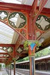 The wrought iron coloumns and awnings